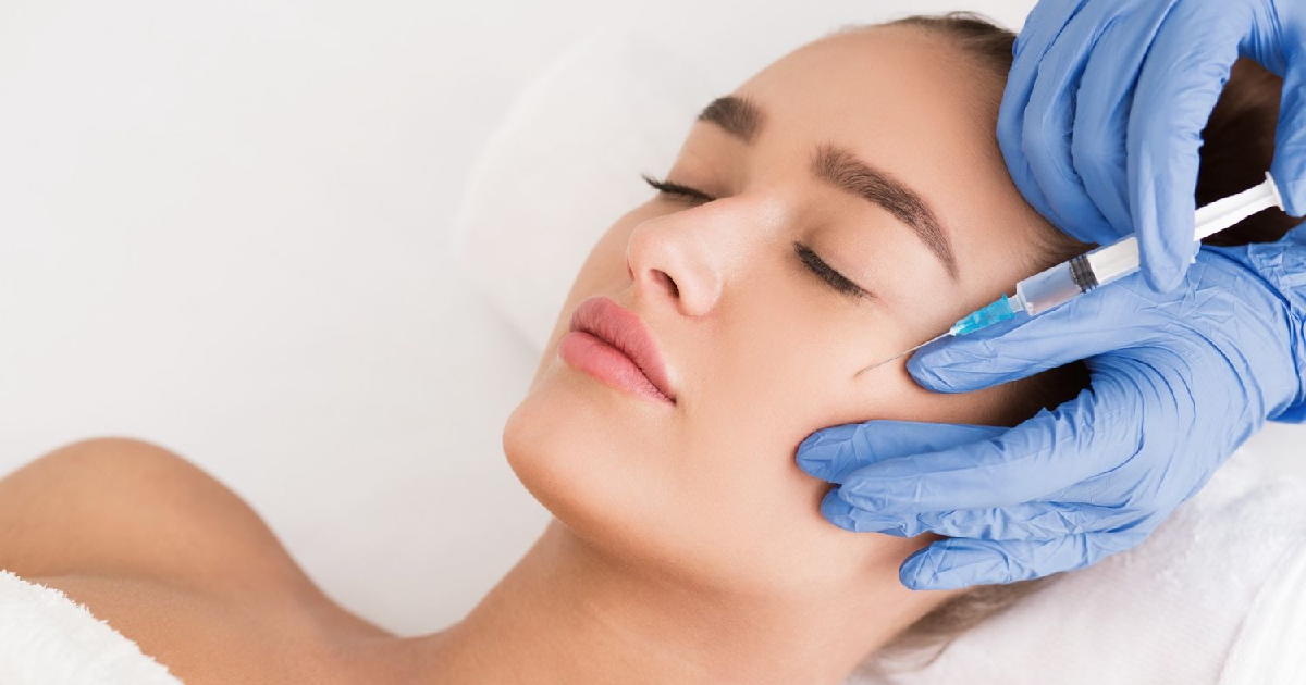 Patient receiving Botox treatment in Lisle, IL, as provider carefully administers injections for smoother, youthful skin.