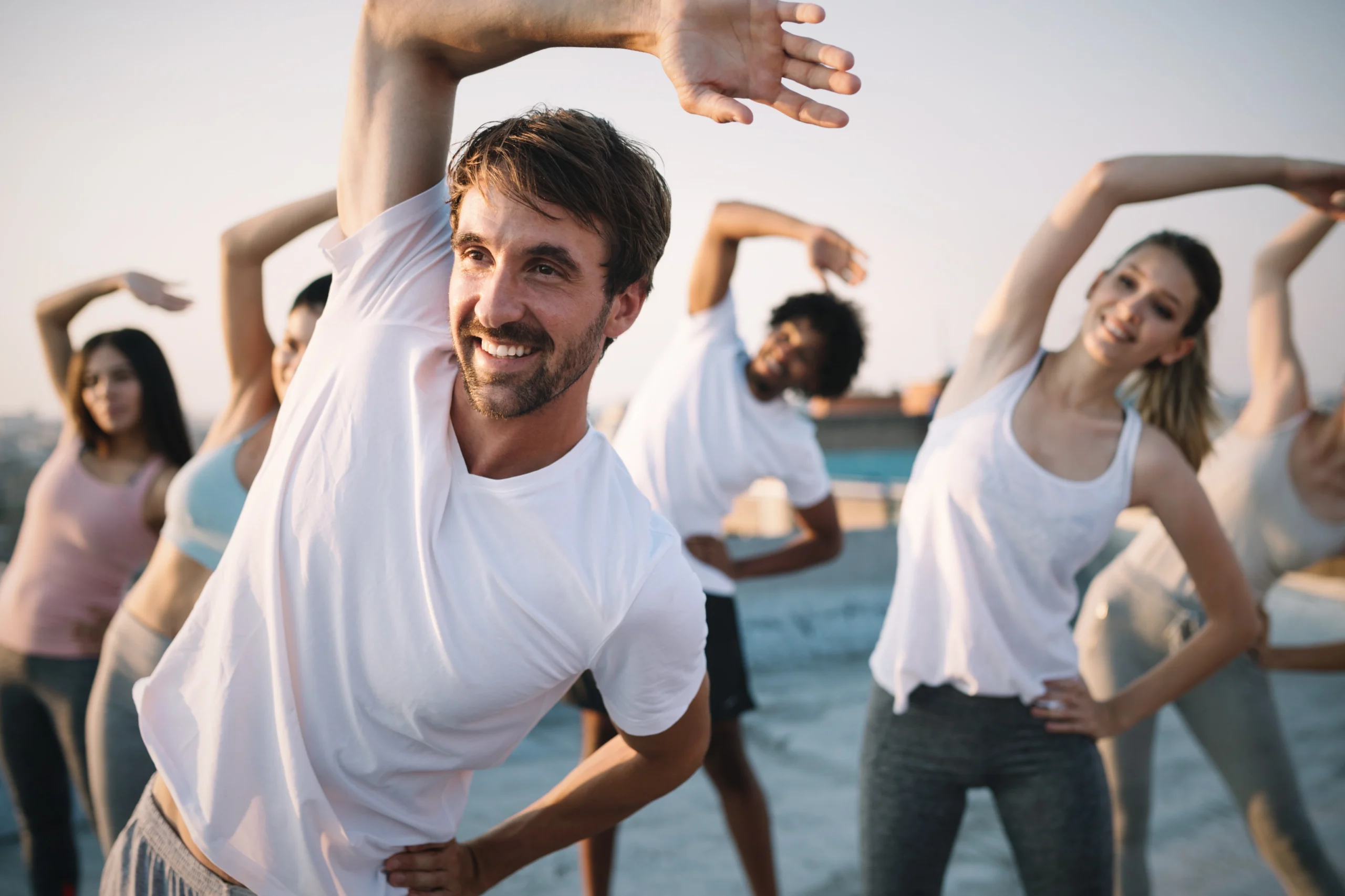 Group of men and women doing exercise in the morning as Preventive Care | Lisle, IL | Advanced Care & Med Spa