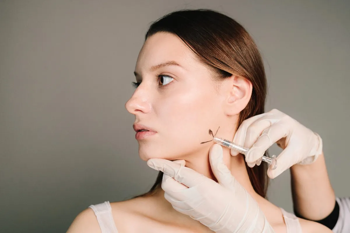 Woman receiving jawline contouring fillers at Advanced Care & Medspa