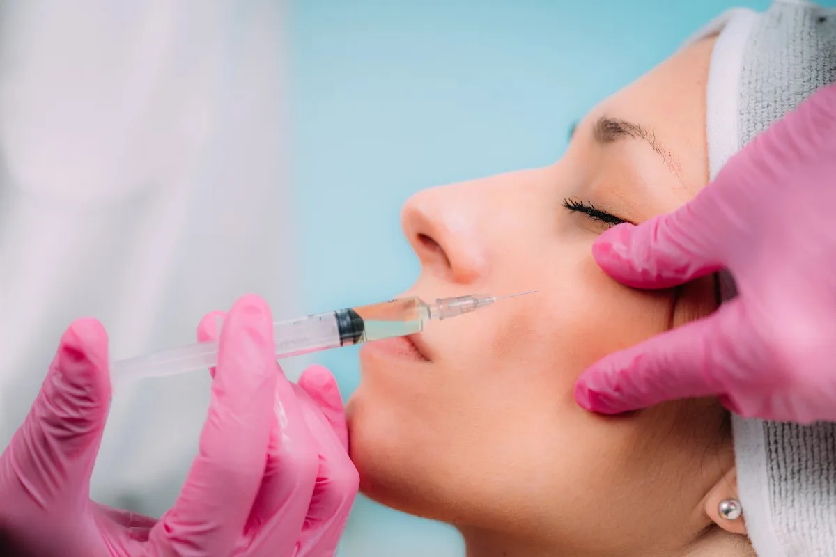 Woman receiving nasolabial fold fillers in Lisle, IL