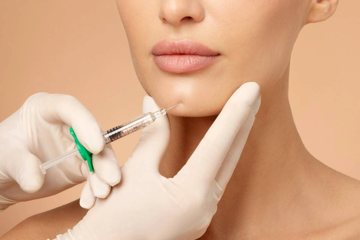 Woman receiving chin fillers in Lisle, IL